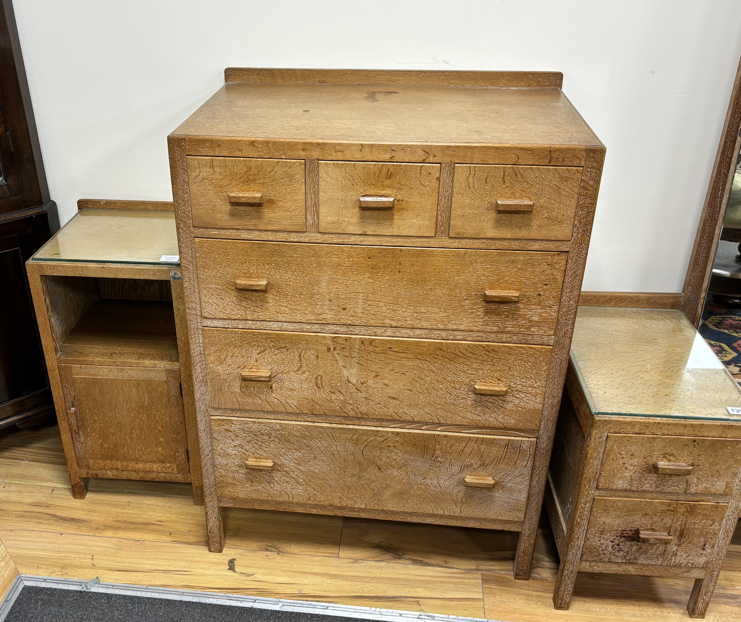 A Heals, London, limed oak six drawer chest, width 76cm, depth 48cm, height 104cm, dressing table and bedside cabinet